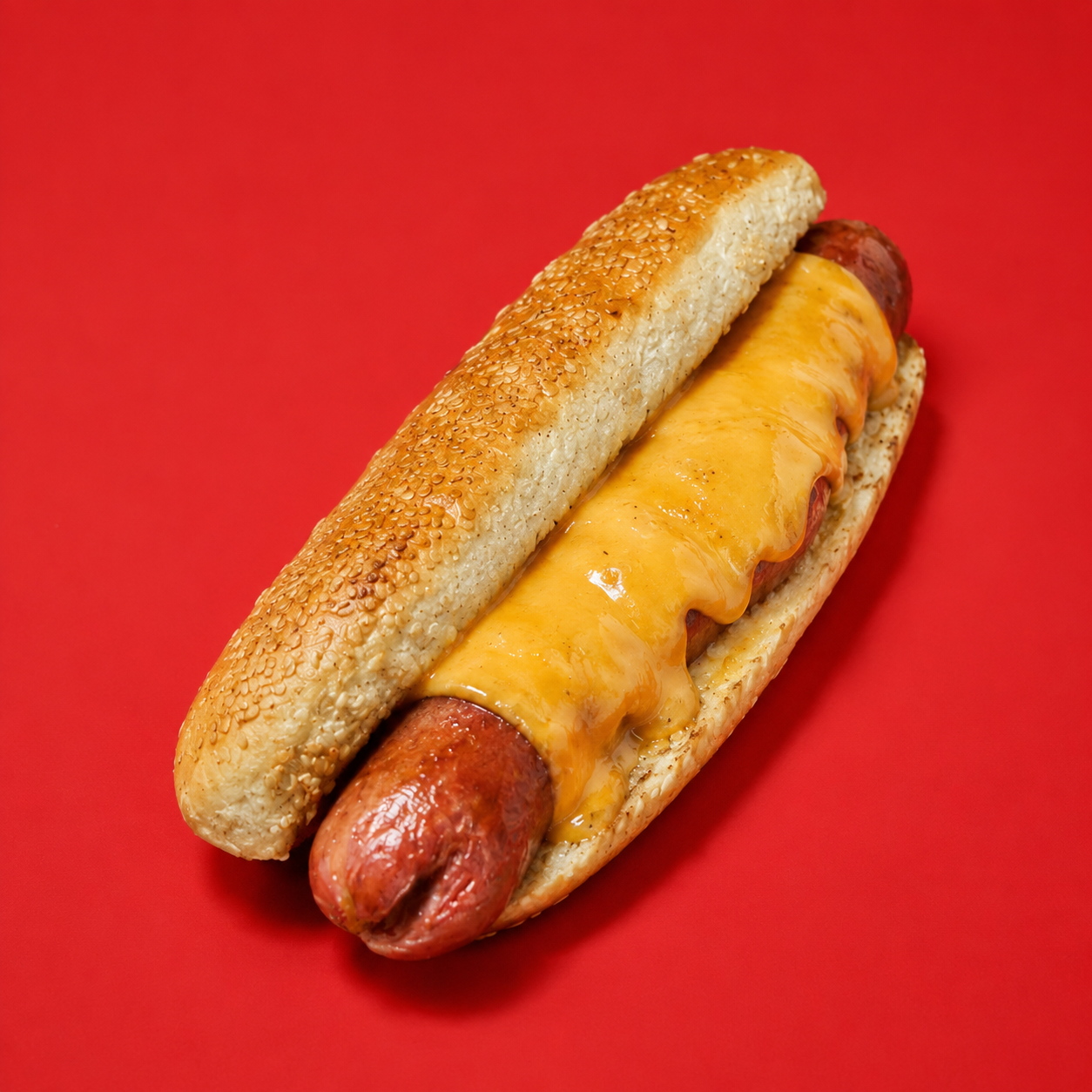 Halal cheese dog with melted American cheese in a sesame bun